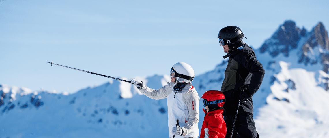 Can You Ski From Meribel to Courchevel? Our Complete Guide. Family of Three Skiing out on the slopes.