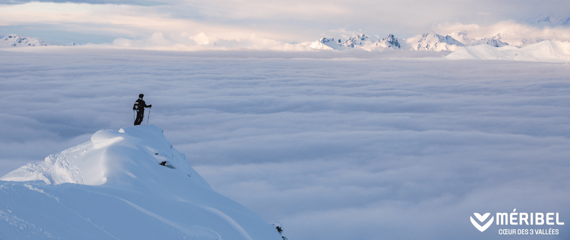 Meribel ski patrol looking out over view above the clouds from a summit in Meribel